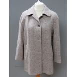 A pure new wool ladies coat by Laure of Leicester, approx measurements; 44" chest, 33.