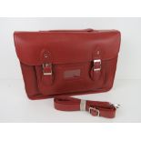 A burgundy satchel type handbag 'as new', approx 38 x 27cm.