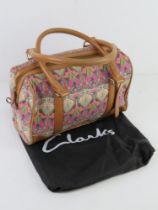 A Liberty pattern fabric and leather handbag by Clarks with original dust bag, approx 32cm wide.