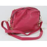 An 'as new' pink studded handbag handbag 19 x 17cm.