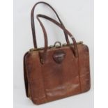 A vintage reptile skin leather handbag having suede lining, mirror within, 23 x 17cm.