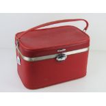 A vintage red Antler travelling case having mirror to lid approx 36.5cm wide.