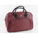 A burgundy coloured overnight bag by Storm London approx 40cm wide.
