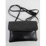 A vintage black patent leather evening shoulder bag by Taurus approx 19cm wide.