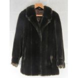 A faux fur jacket approx measurements; 40" chest, 31" length at back and 17" sleeve underarm.