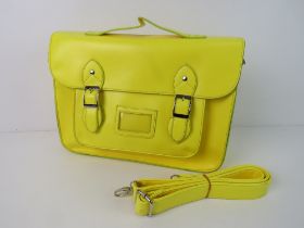 A Neon yellow satchel type handbag 'as new', approx 33 x 23cm.