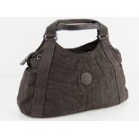 A brown canvas handbag by Kipling approx 45cm wide.