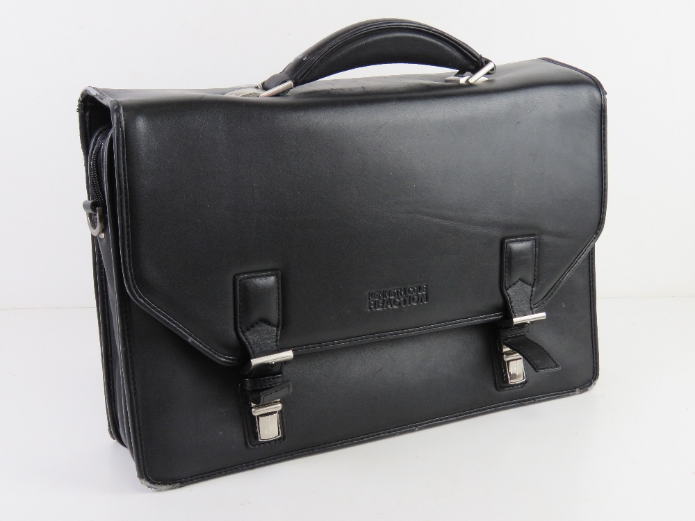 A Kenneth Cole brief case some wear noted to edges, approx 41cm wide.