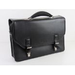 A Kenneth Cole brief case some wear noted to edges, approx 41cm wide.