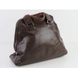 A brown leather handbag by Per Una, mark to lining noted, approx 35cm wide.