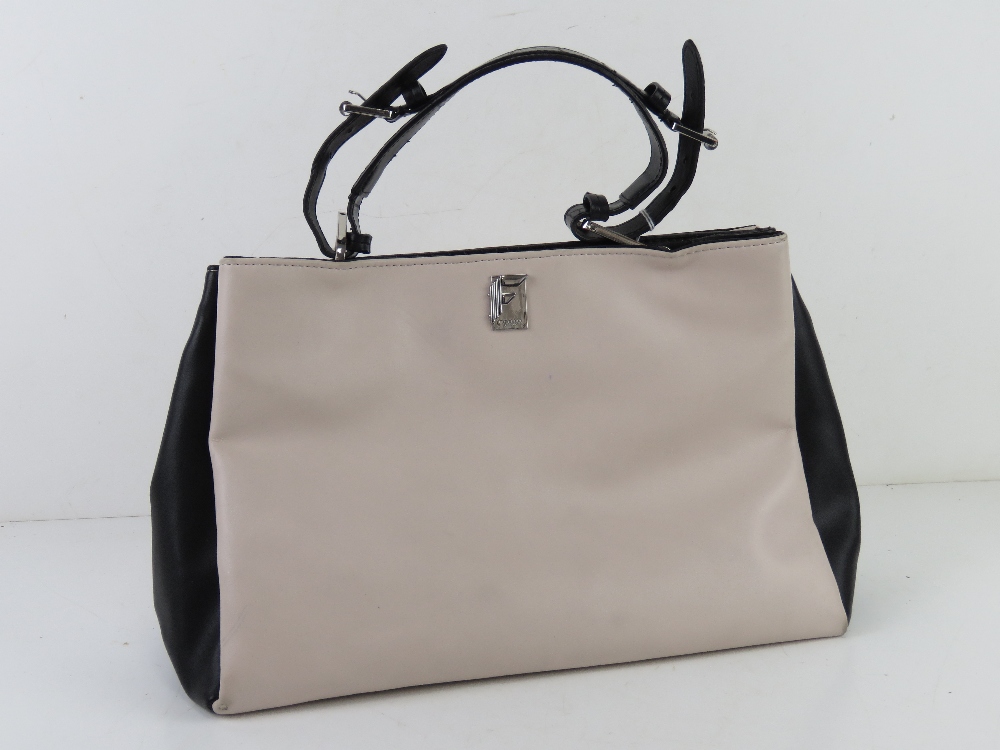 A blush and black leather handbag by Fiorelli approx 35cm wide.