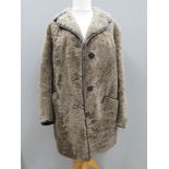 A vintage sheepskin jacket bearing label for Owen Barry, size 42,