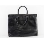 A vintage Italian black leather brief case type handbag 40cm wide.