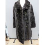 A vintage faux fur coat, approx measurements; 42" chest, 42.5" length to back, 16" underarm sleeve.
