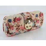 A floral fabric clutch bag, approx 24cm wide.