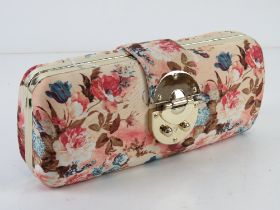 A floral fabric clutch bag, approx 24cm wide.