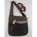 Radley; a brown cross body bag having pink dog key chain upon, approx 25cm wide.