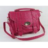 A hot pink satchel type handbag, approx 36cm wide.