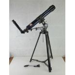 A Bresser telescope with stand.