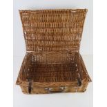 A wicker hamper measuring 52 x 37 x 19cm.