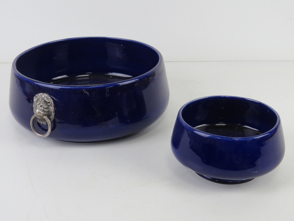 Two blue Wade Falstaff bowls, the larger having lion head handles and measuring 21cm diameter.