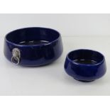 Two blue Wade Falstaff bowls, the larger having lion head handles and measuring 21cm diameter.