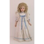 A handmade 20th century bisque headed doll made using an antique doll mould,