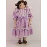 A handmade 20th century bisque headed doll made using an antique doll mould,