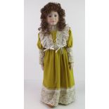 A handmade 20th century bisque headed doll made using an antique doll mould,