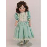 A handmade 20th century bisque headed doll made using an antique doll mould,