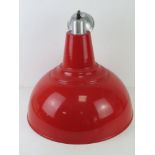 A large contemporary red painted industrial style lamp shade, 41.5cm dia.