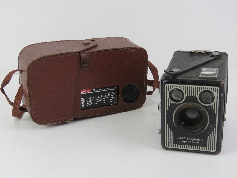 Two vintage cameras; Kodak 8 movie camera f/1.9, and a Kodak Six-20 'Brownie' E.