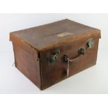 An antique silk lined leather travelling case, slightly a/f, with twin locks,