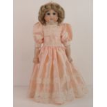 A handmade 20th century bisque headed doll made using an antique doll mould,