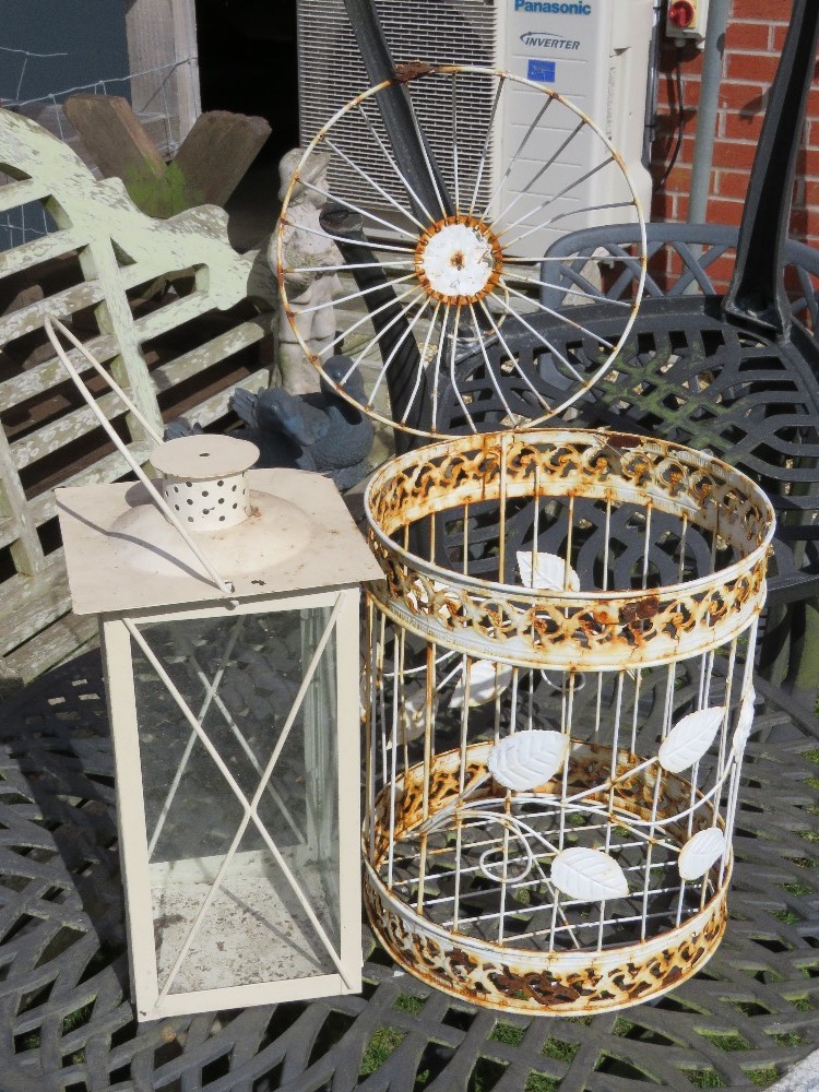 A white painted 'bird cage' and a large white painted lantern.