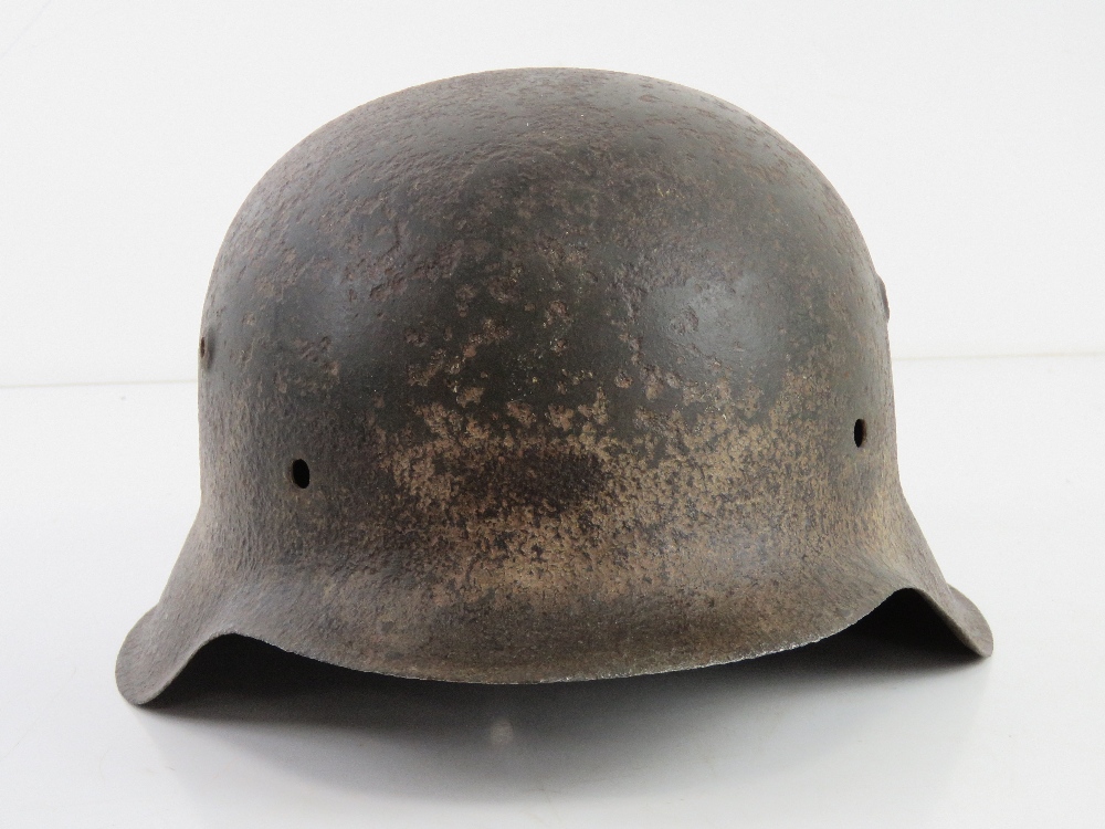 A WWII German M42 single decal (indistinct) semi relic Afrika Korp Army helmet. - Image 2 of 6