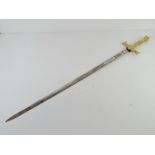A Masonic sword with a patterned blade.