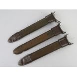 Three WWII M1 Garand bayonet scabbards.