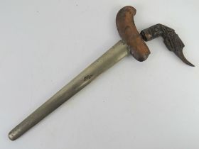 A Kris knife with scabbard.