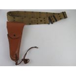 A Colt 1911 leather holster and belt.