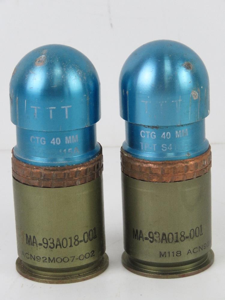 Two inert CTG 40mm grenades.