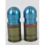 Two inert CTG 40mm grenades.