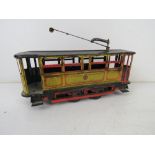 A tin plate clockwork tram measuring approx 17cm in length.