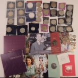 A quantity of assorted 20th century crowns and commemorative coin sets including 2006 QEII Birthday,