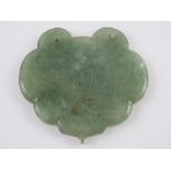 A jade pendant panel having engraved floral decoration with four character marks verso, 5.5cm