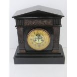 Tiffany & Co; a late 19th century Architectural polished slate mantel clock having gilded chapter