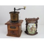 A phoenix Gesmeed Binnenwerk brass coffee grinder together with a tea canister. Two items.