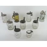 A quantity of assorted glass tankards inc BMF boars head design, hand painted ceramic and pewter lid
