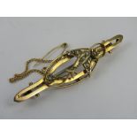 A 9ct gold Edwardian brooch having seed pearls and Swallow design, stamped 9c, 2.8g.