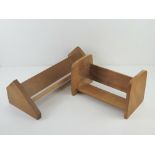 Two 20th century wooden book sleighs measuring 30cm and 46cm respectively.